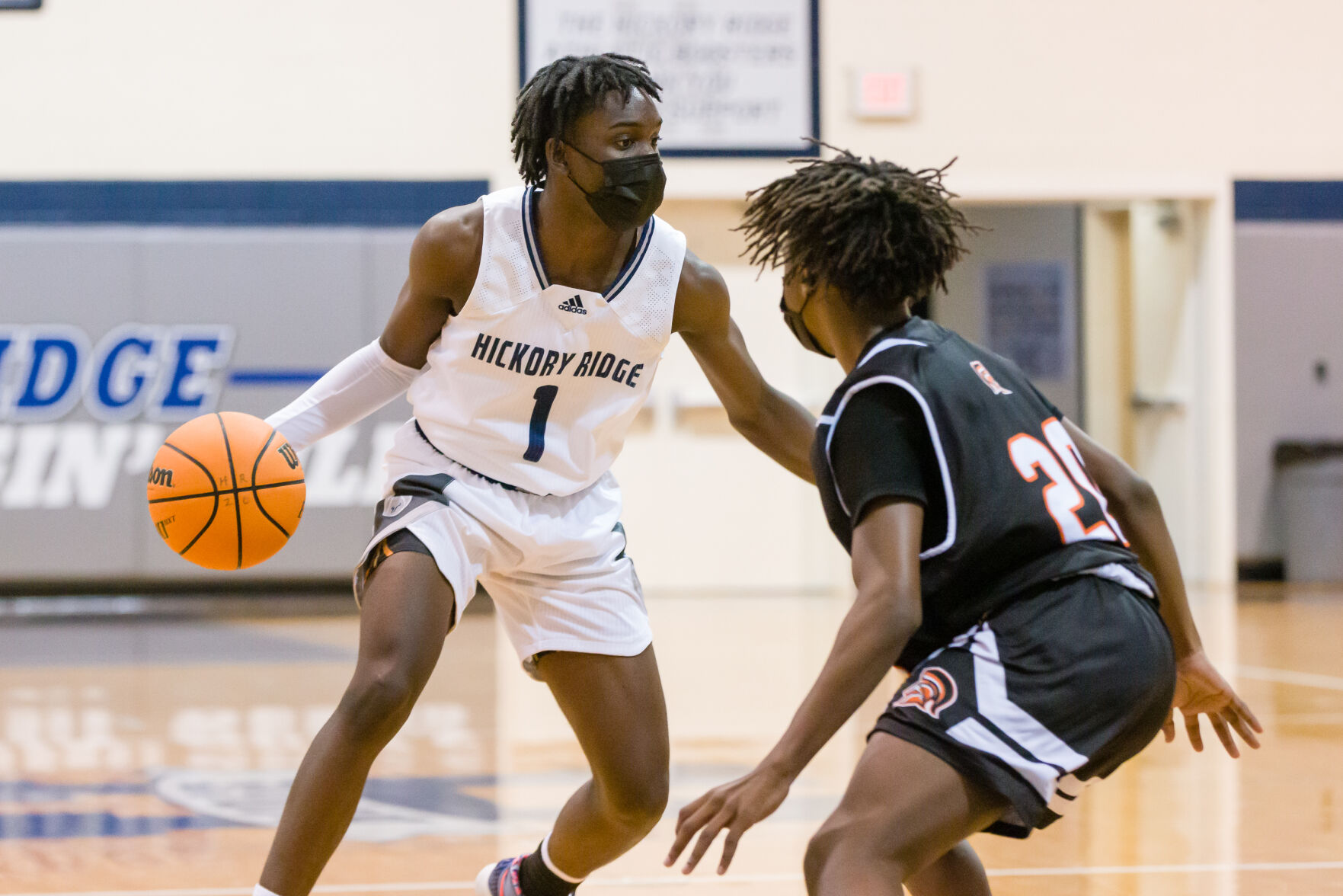 Boys Basketball: Hickory Ridge RaginÕ Bulls defeated the Northwest Cabarrus Trojans 64-56.